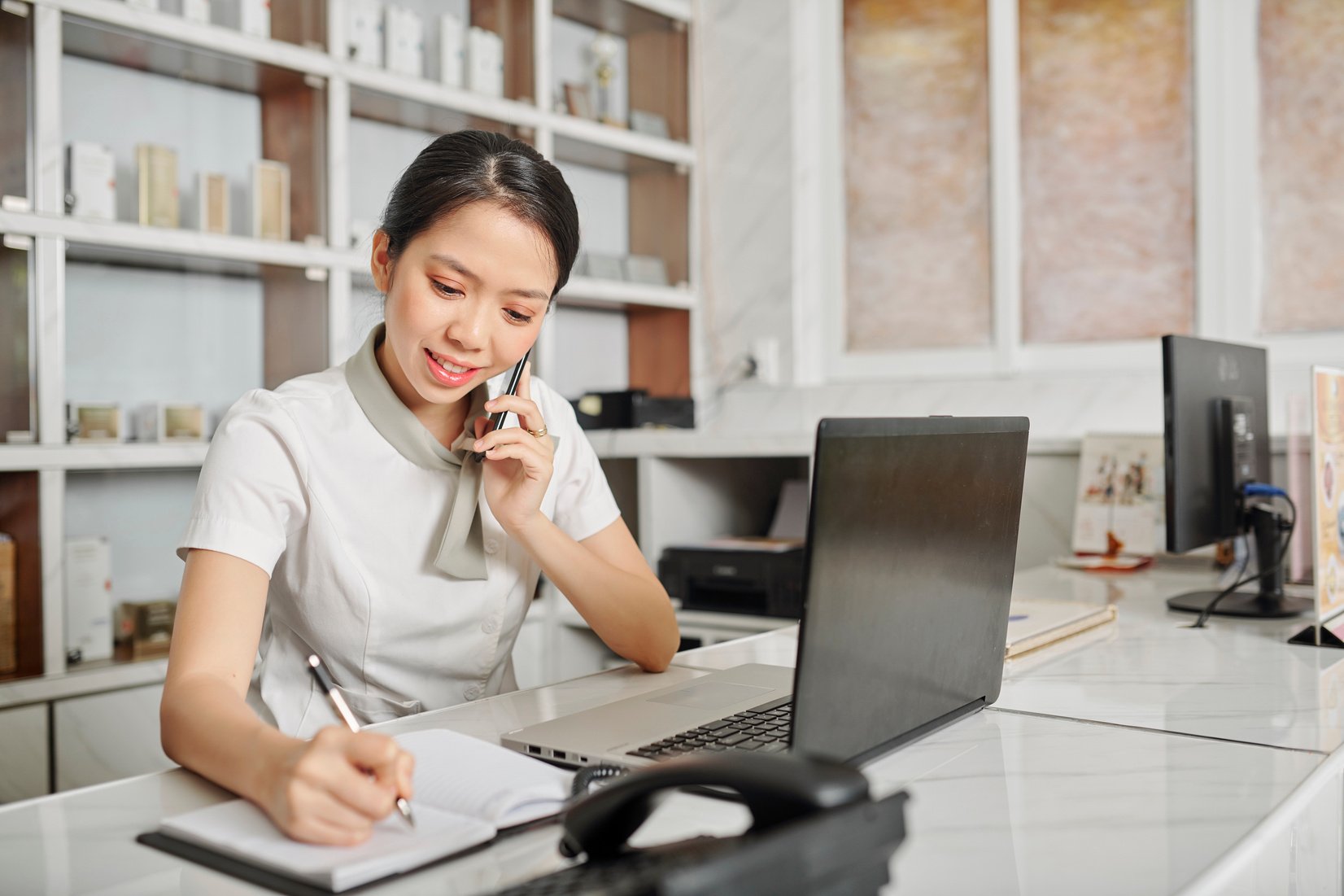 Receptionist Answering Phone Call